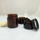 Face cream amber glass jar with black plastic cap