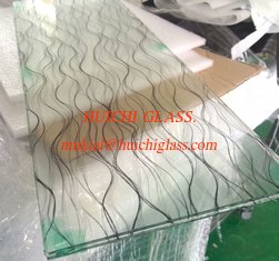 Decorative fabric insertion for laminated glass