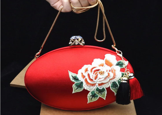 China Luxury Oval Shape Embroidered Velvet Bag , Satin Clutches Evening Bags With Two Tassel supplier