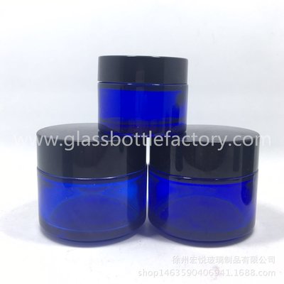 China 50g,100g Blue Round Glass Cosmetic Jar With Black Lids supplier