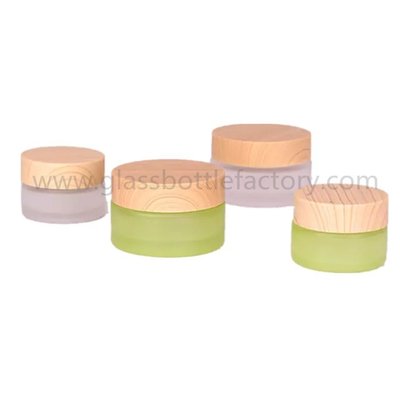 China 20g,30g,50g Colored Round Glass Cosmetic Jars With Wood Lids supplier
