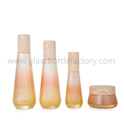 China New Items 40ml,100ml,120ml,50g Colored Glass Lotion Bottles And Cosmetic Jars With Wood Caps For Skincare supplier