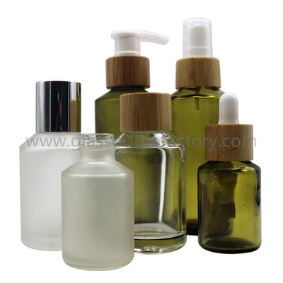 China 30ml,60ml Frost Olive Green Glass Lotion Bottles With Bamboo Droppers or Pumps supplier