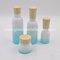 150ml,120ml,40ml Colored Opal Glass Lotion Bottles With Wood Caps and 50g,150g Opal Glass Cosmetic Jar With Wood Cap supplier