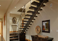 wooden tread staircase with tempered clear glass railing top handrail