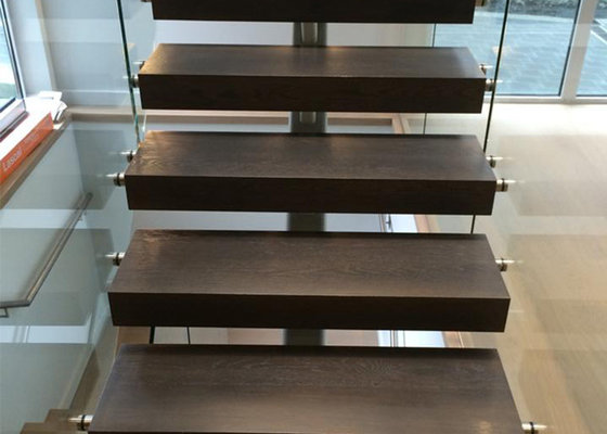 black color wooden tread staircase with tempered clear glass railing