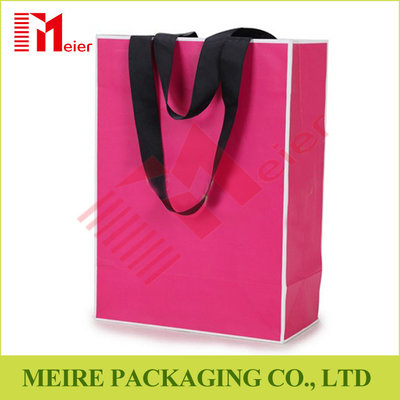 China Recycled Medium Pink color printing Paper Carrier Bags with customized LOGO and black handle supplier
