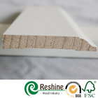White primer coated pine and fir wood baseboard architrave mouldings