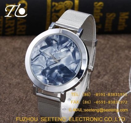 China Unique wavy style and colorful dial for ladies watch with alloy band supplier