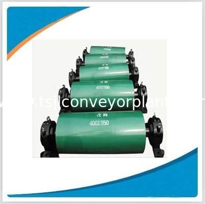 Motorized tail pulley for steel conveyor system