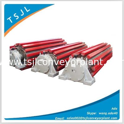 Self- cleaning steel wing pulley with material handing parts conveyor