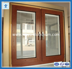 China Modern house aluminium sliding window in wooden color with grill design supplier